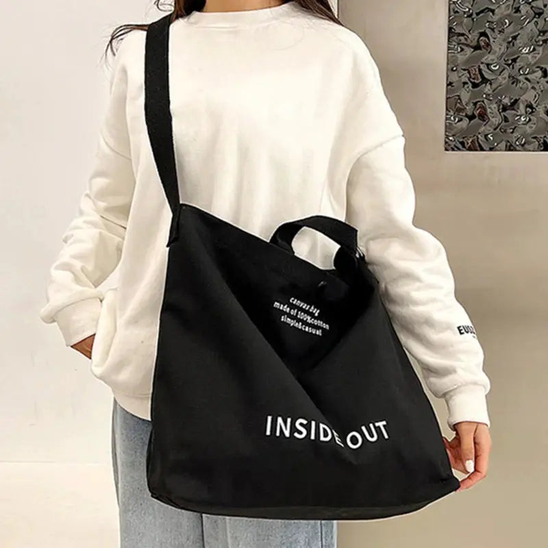 Canvas crossbody bag, black with InsideOut branding, large capacity