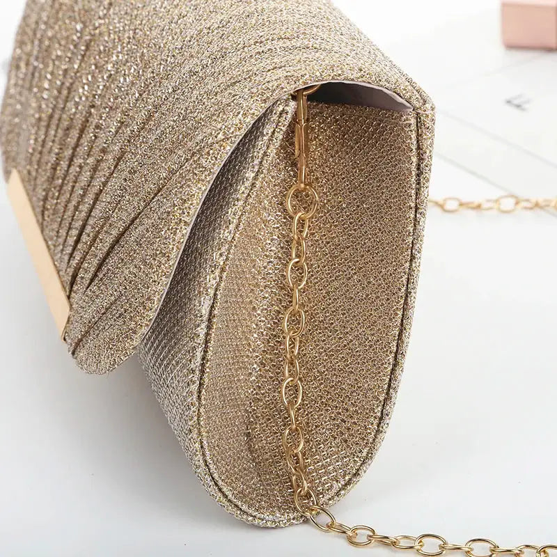 Sequined gold evening bag with chain strap for formal events