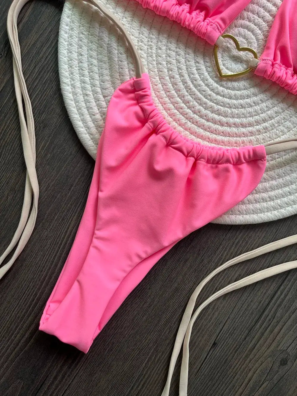 Pink two-piece halter bikini with triangle thong bottoms by Simples Market.