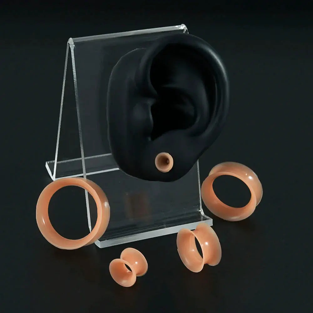 Flesh-toned silicone ear tunnels set; soft, flexible gauge plugs in multiple sizes