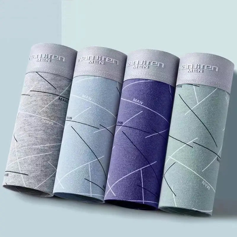 4-pack men's cotton boxer shorts rolled up; gray, light gray, purple, and teal with branded waistbands