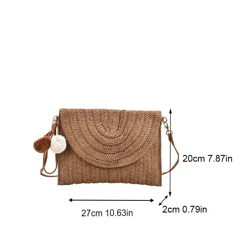 Handmade straw beach crossbody bag; natural beige woven envelope style with pom-pom charms