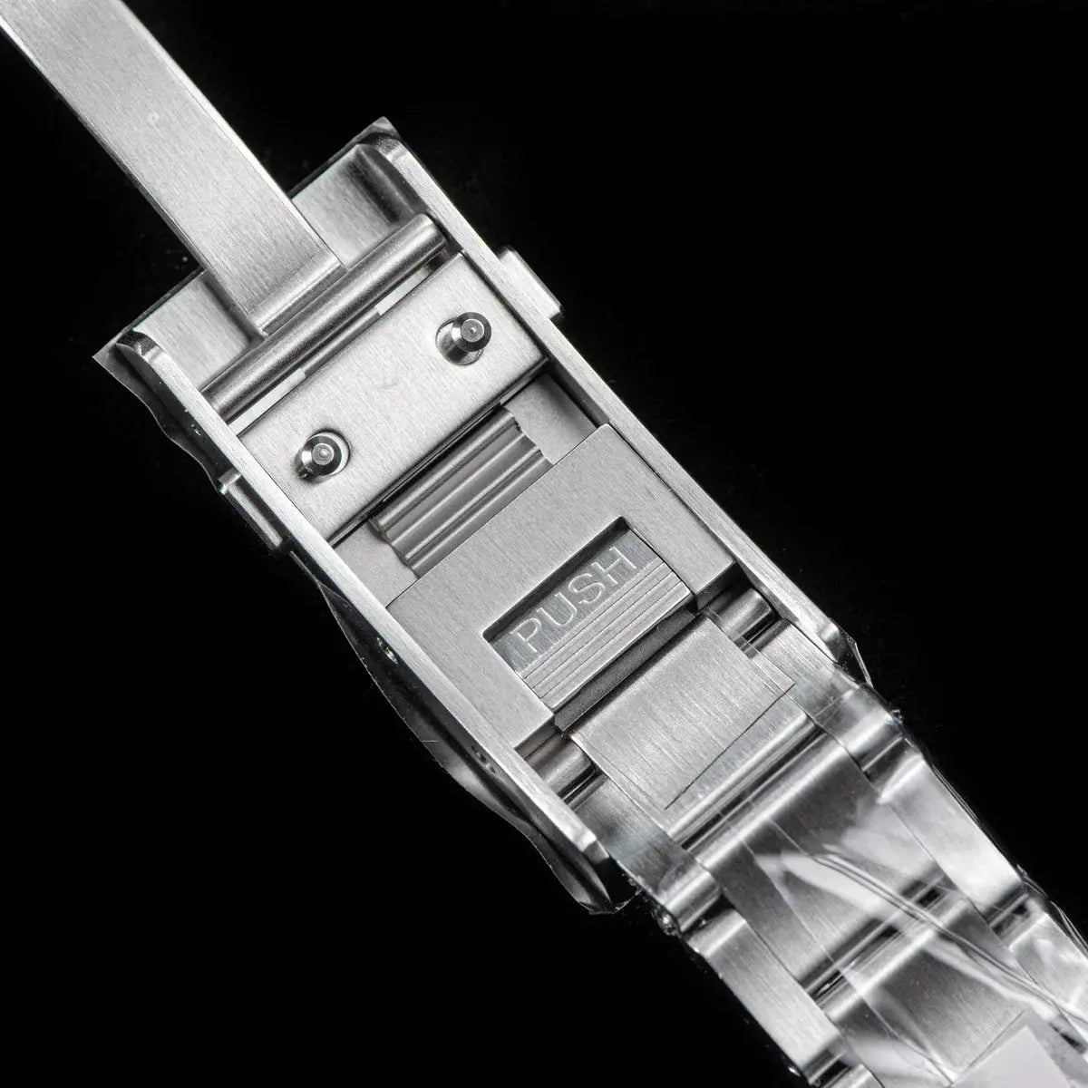 Stainless steel SEESTERN diver watch bracelet with push-button deployment clasp and silver-toned links.
