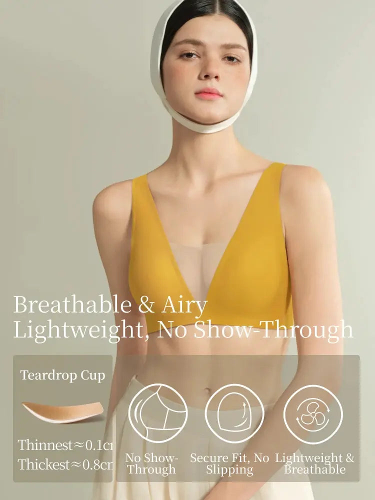 Seamless plunge bra in mustard yellow with sheer mesh V-panel on model