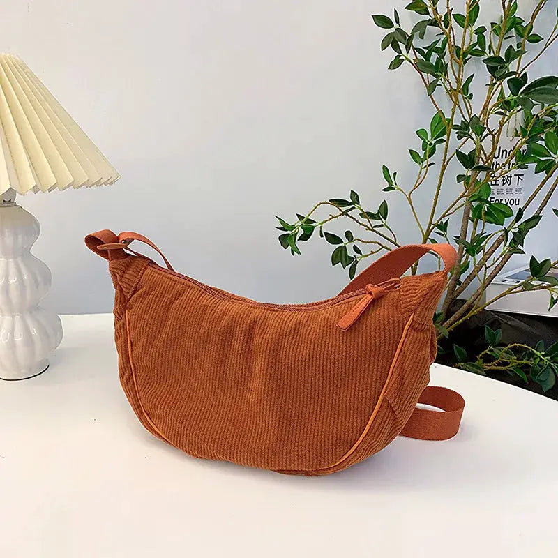 Corduroy hobo shoulder bag by Simples Market in rust orange with a long crossbody strap
