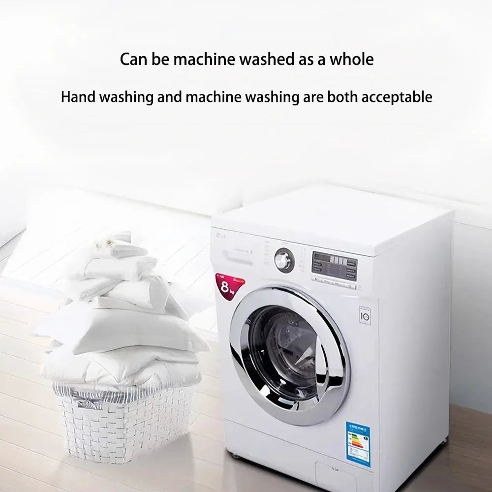 Front-loading white washing machine with chrome door beside a basket of folded white towels and linens.