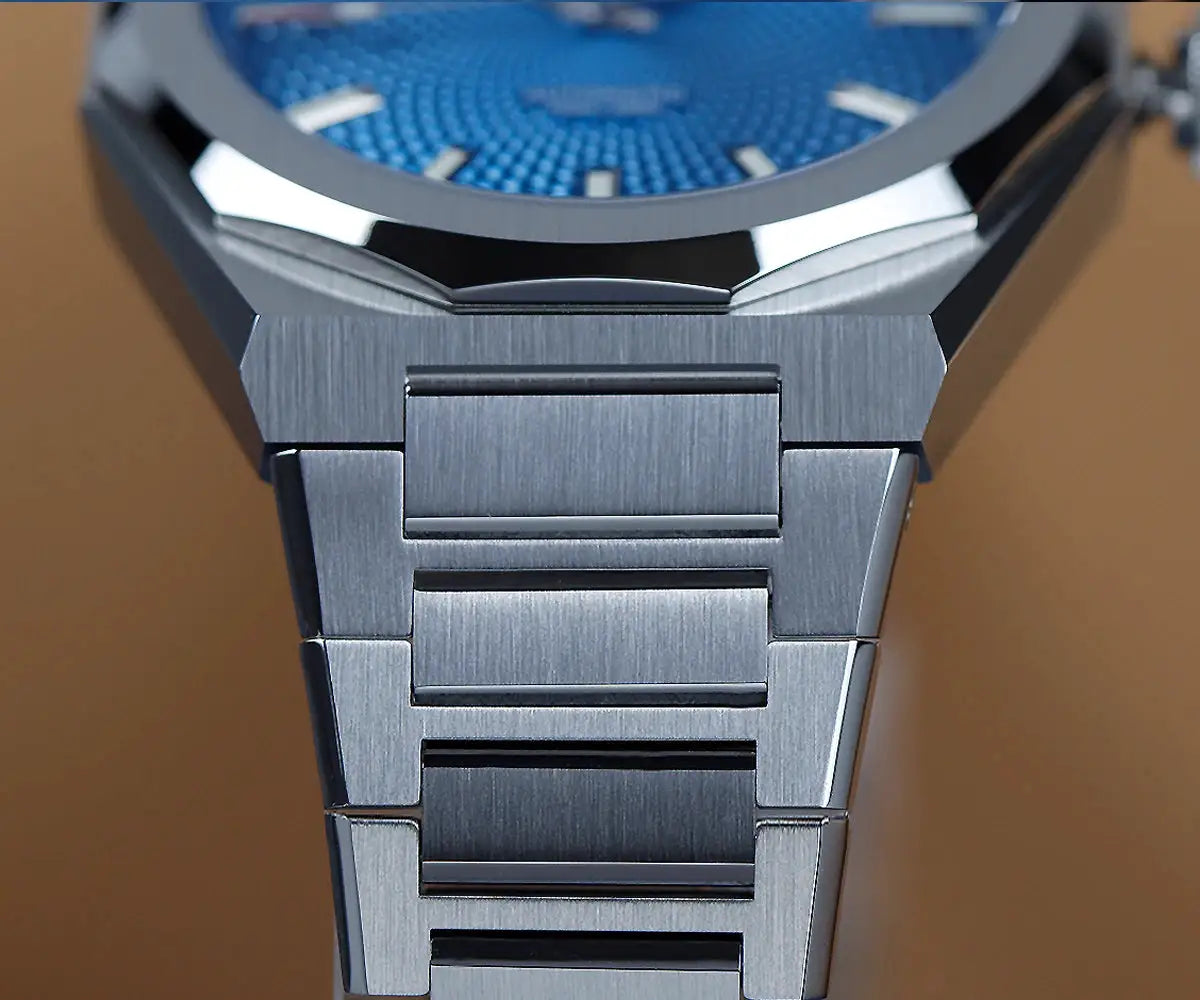 Cronos New Rhombus Perlage 39mm watch with skeleton blue dial and stainless steel bracelet, automatic.