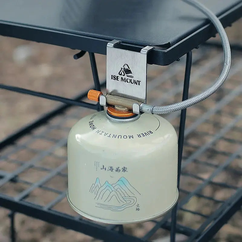 Gas canister hook with metal hanging plate securing propane canister on a camping grill