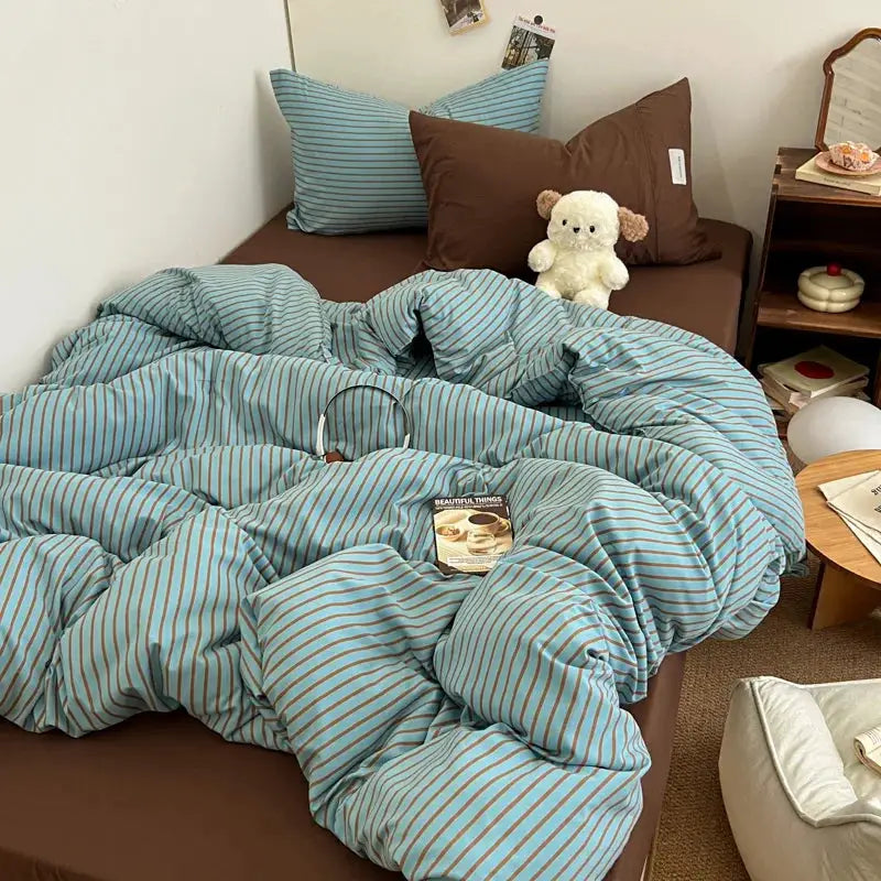 Bedding set with blue striped duvet cover and pillowcases, bedsheet included
