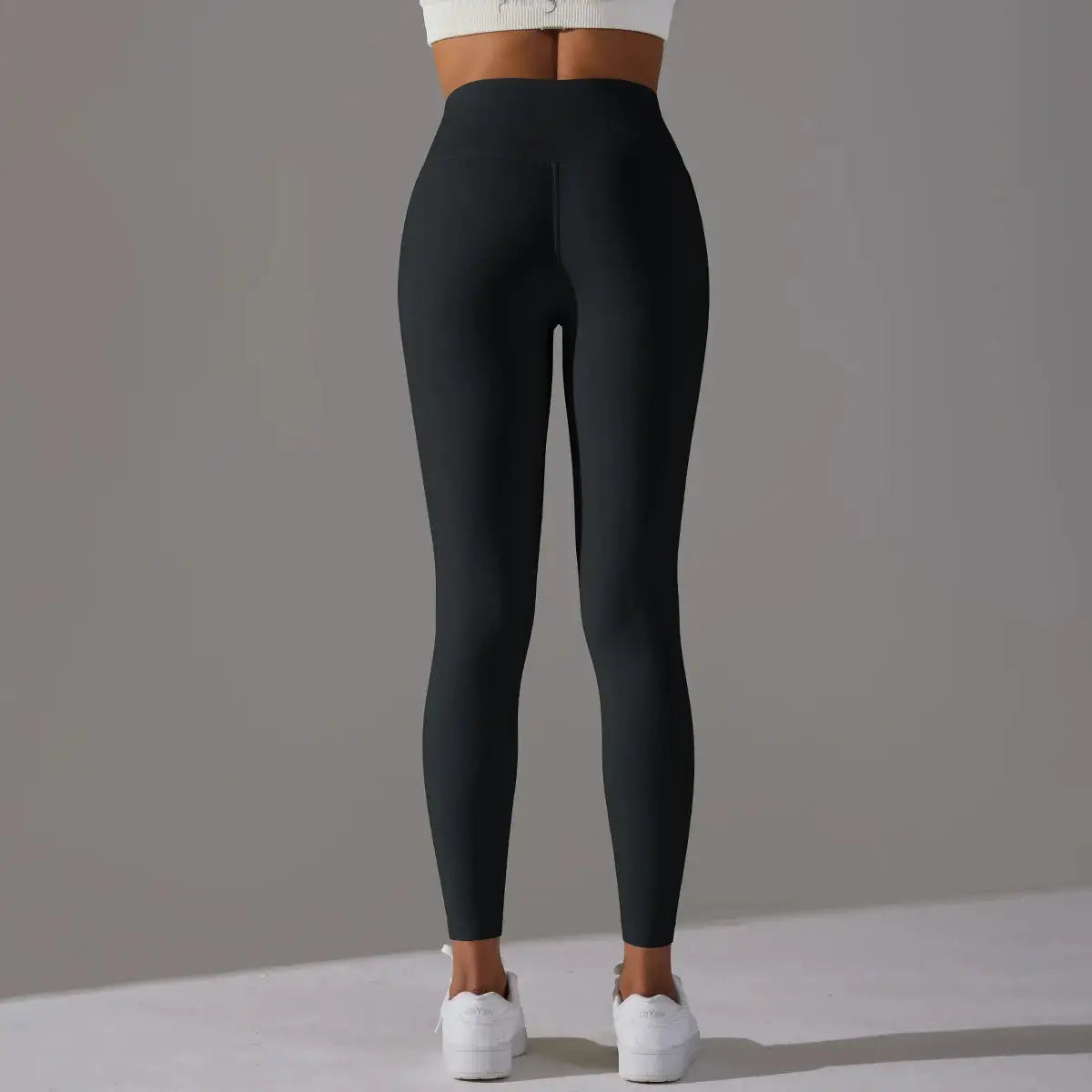 High waist black leggings for women; ideal for fitness, running and yoga with a tight, flattering fit.