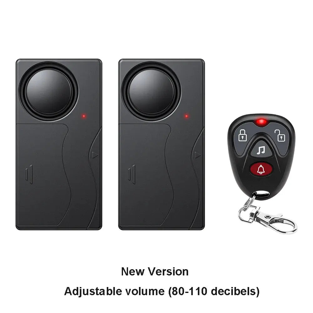 Anchtek 110dB wireless vibration alarm kit with remote; two black alarm units and a keychain remote.
