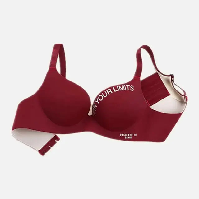 Simplicity red seamless bralette by Simples Market with white lettering, deep-V cups, adjustable straps