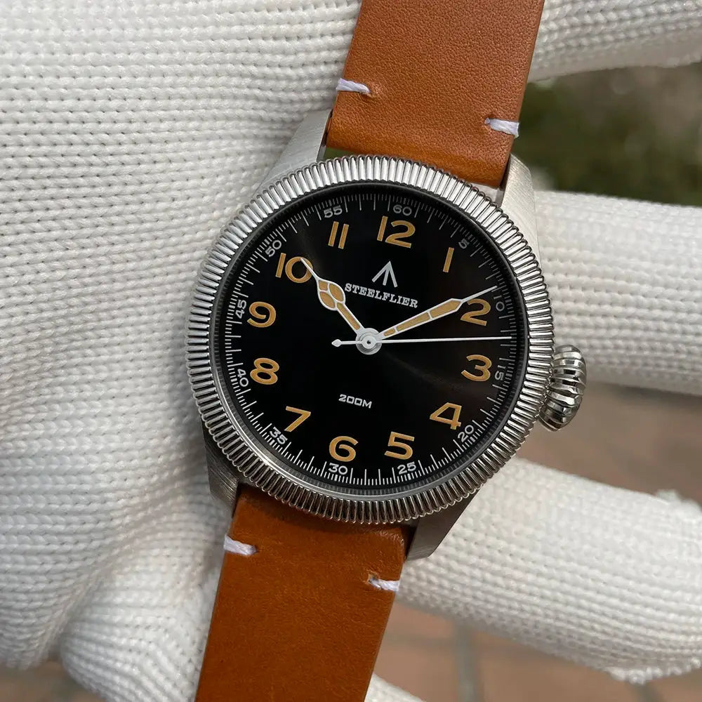 STEELFLIER SF741 quartz wristwatch with black dial, beige numerals, brown leather strap, 200M water resistance