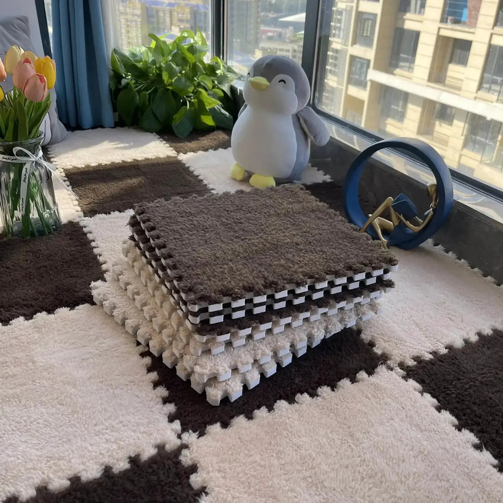 Soft plush EVA foam puzzle mat set with interlocking brown and beige 30 cm tiles on a shaggy rug