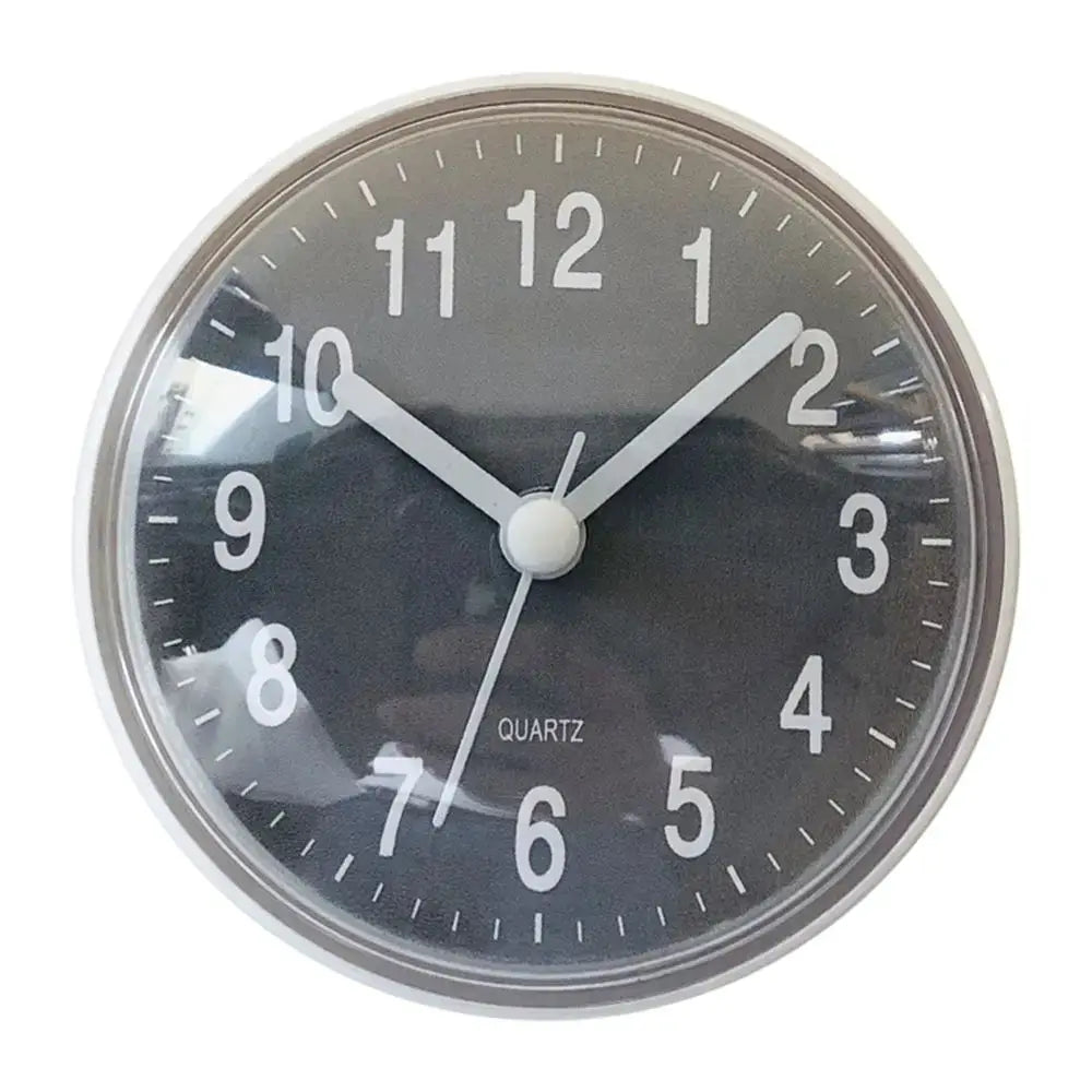 Mini 7cm round wall clock with black dial, large white numerals and white hands, quartz movement