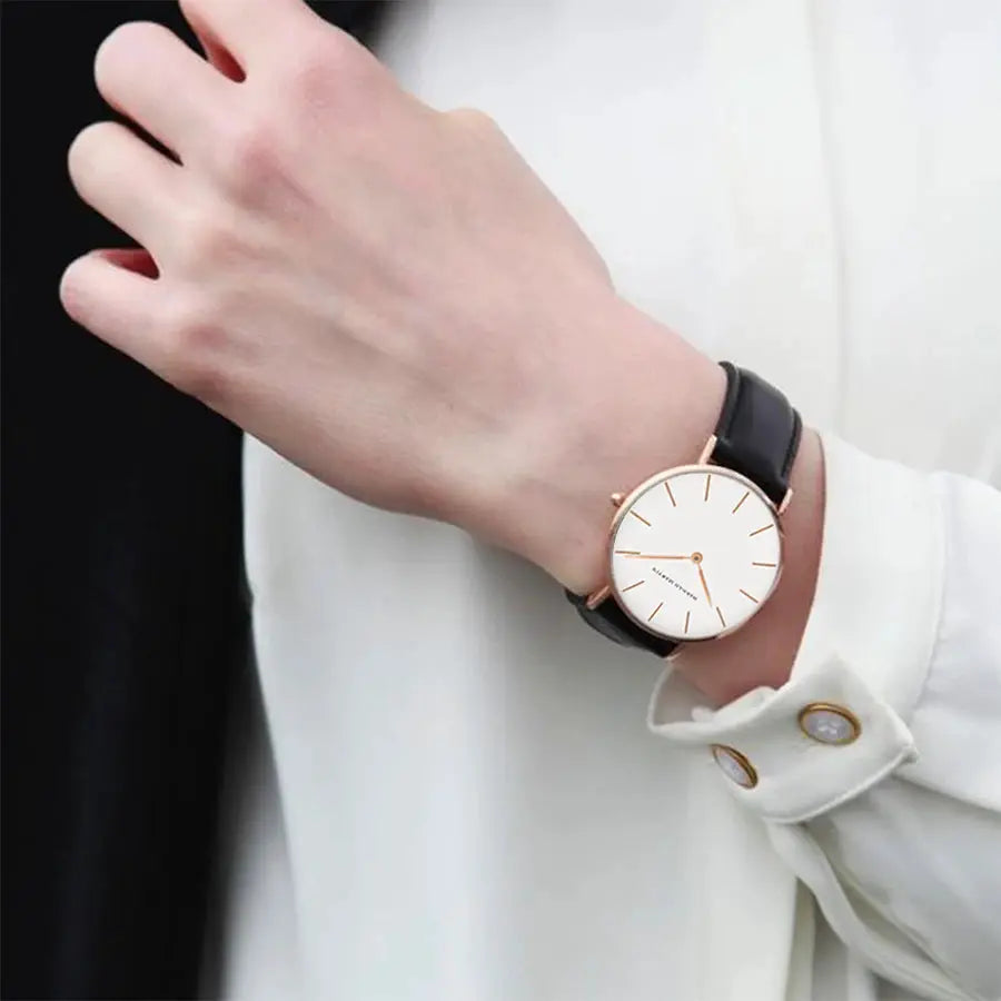 Women's 36mm wristwatch with white dial, rose-gold case and black leather strap