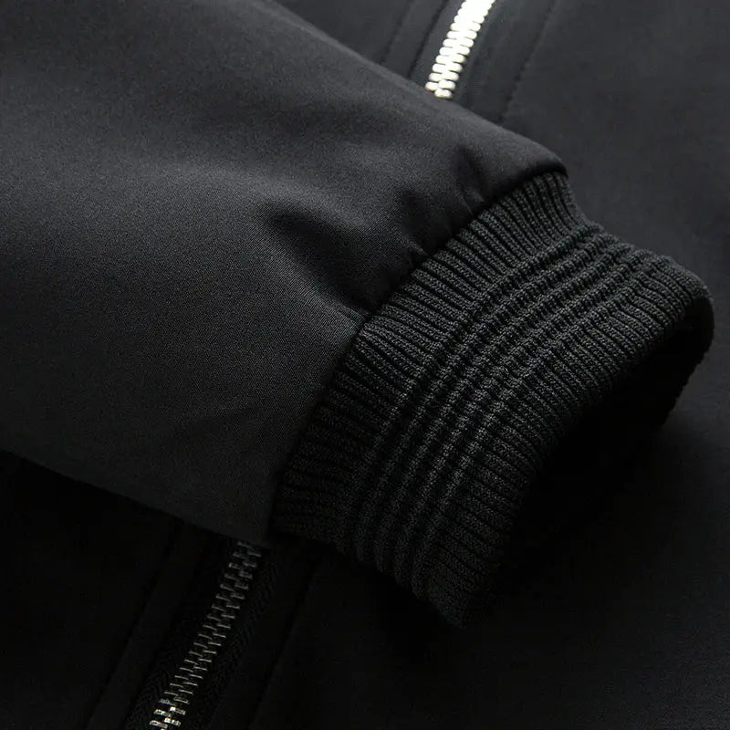 Men's black bomber jacket with zip front, slim thin windbreaker style and ribbed cuff.
