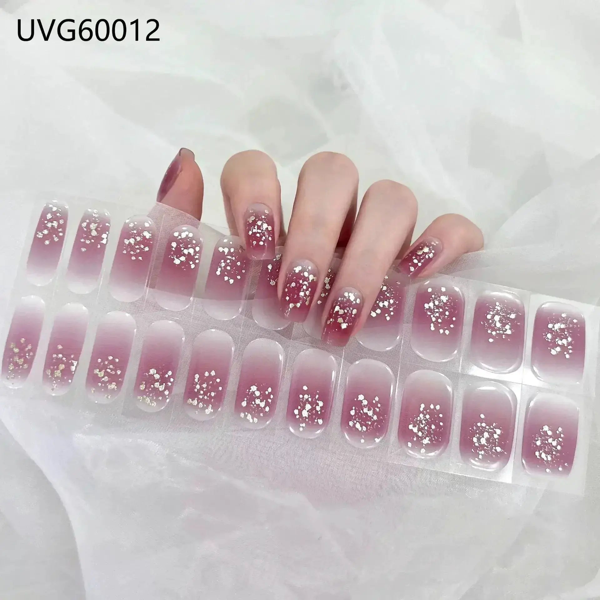 Gel nail wraps set by Simples Market, 12 pink gradient full-coverage gel stickers with white glitter specks.