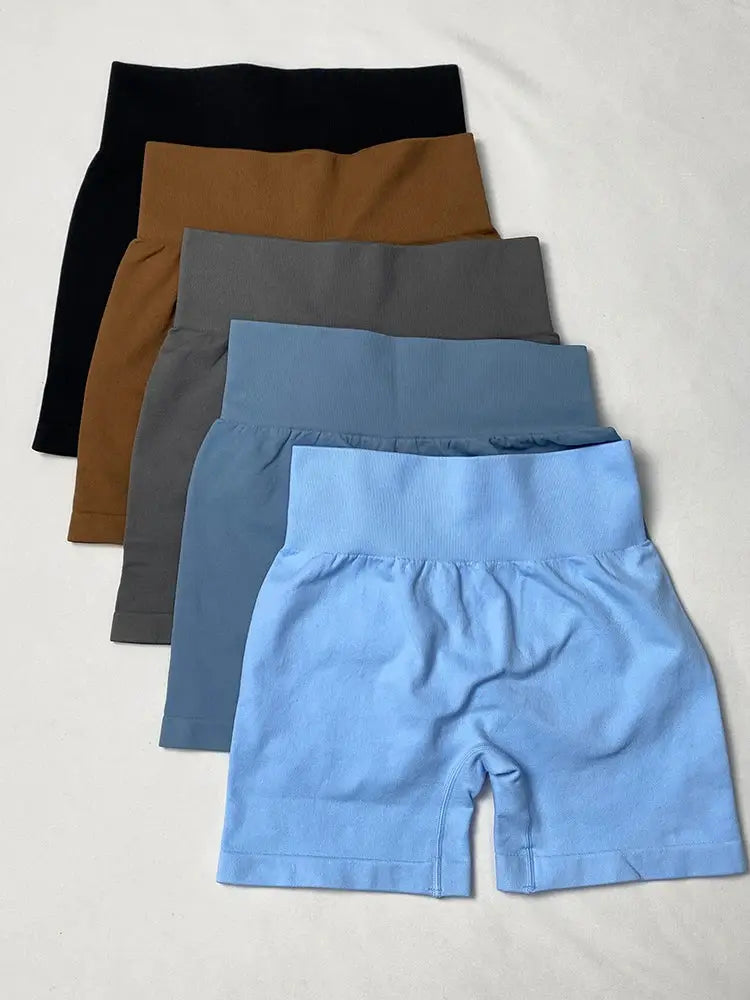 Women's high-waisted yoga shorts set in black, brown, gray, and two blues (5-pack); seamless hip-lifting sports shorts