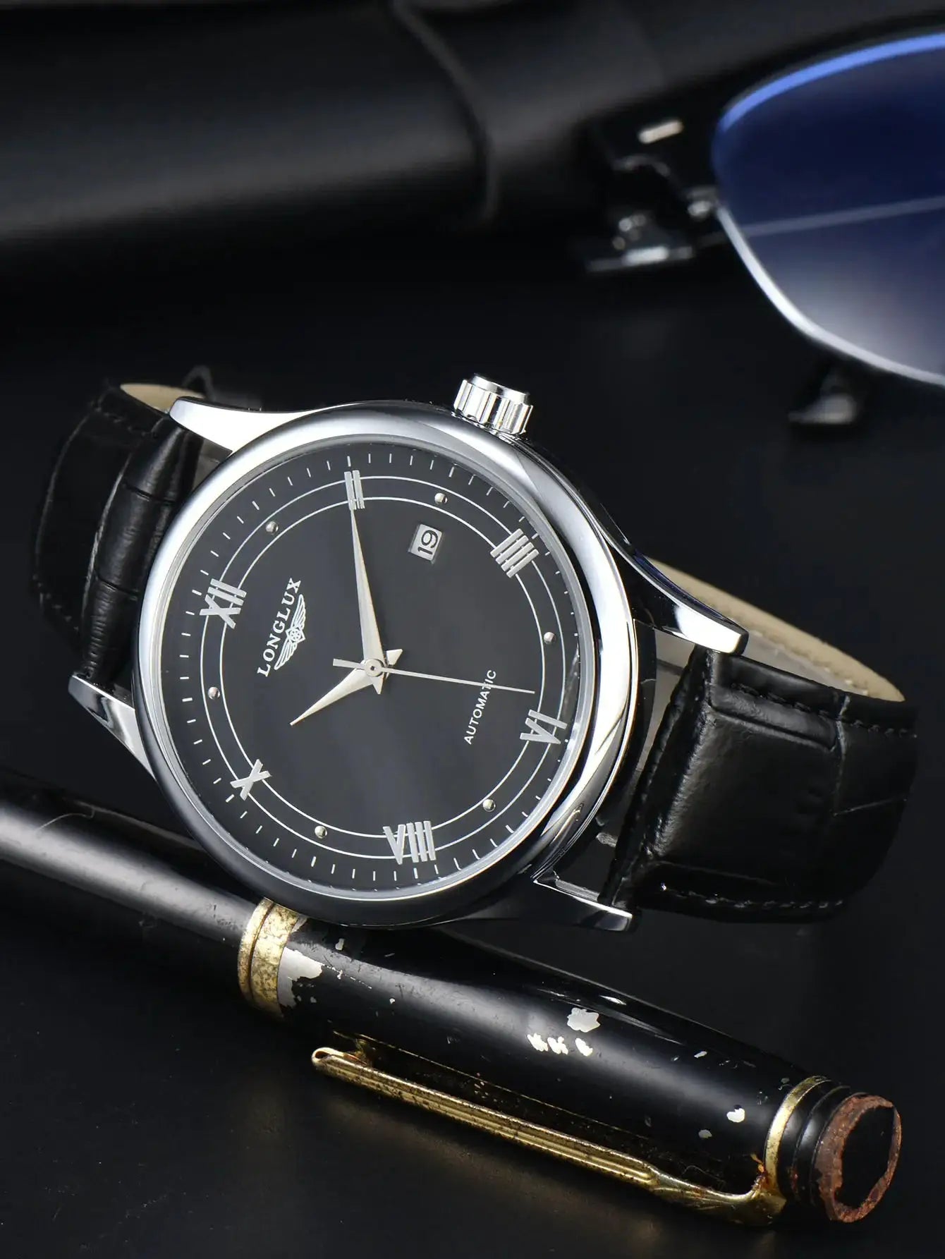 LONGLUX automatic men's watch with black dial, silver case, leather strap and date window