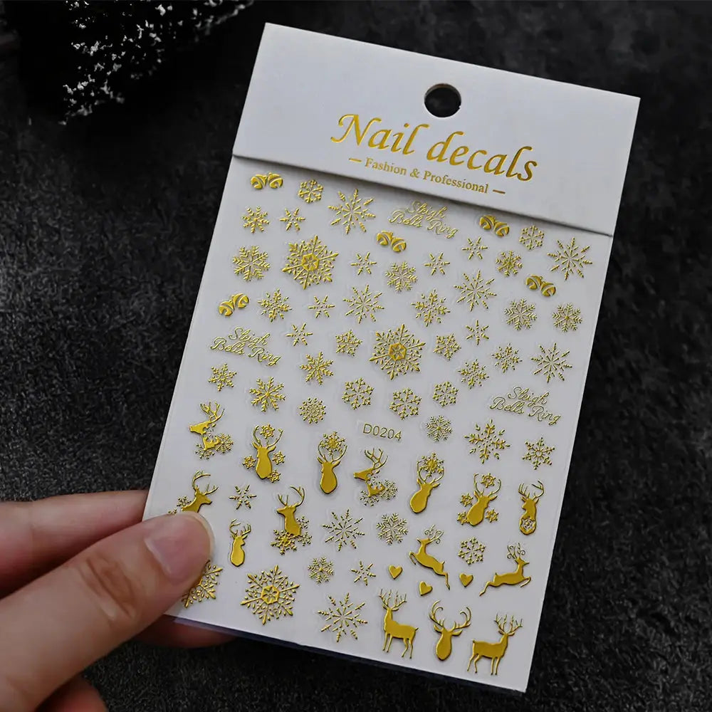 Winter Christmas nail decals sheet in gold with snowflakes and reindeer silhouettes for self-adhesive nail art