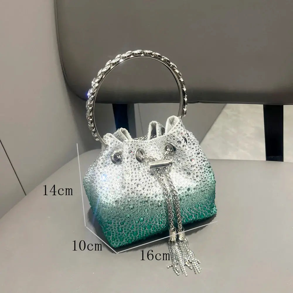 Evening rhinestone clutch with crystal-ring handle, white to teal gradient, tassel chain
