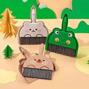 Set of three mini cartoon desktop cleaning brooms with animal faces (bear, bunny, frog) and black bristles