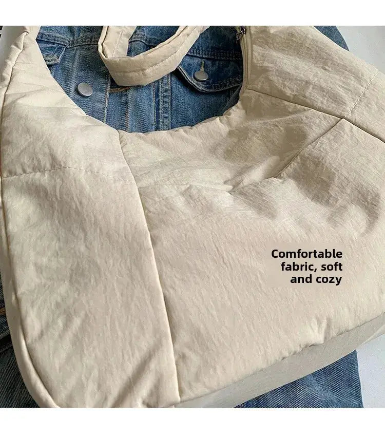 Beige soft-cloth shoulder bag, solid color crossbody style for women.