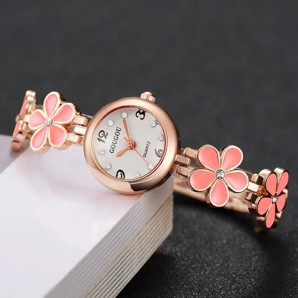 Women's rose-gold quartz watch with pink flower bracelet strap and crystal-embellished dial