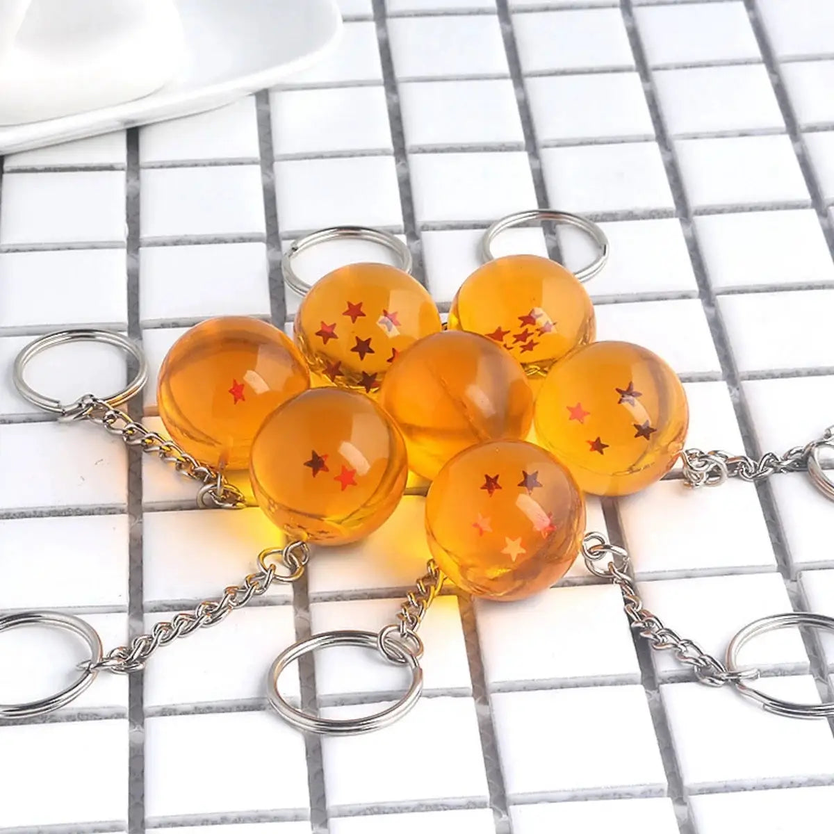 Dragon Ball keychains set of seven orange beads with red stars on metal chains and rings