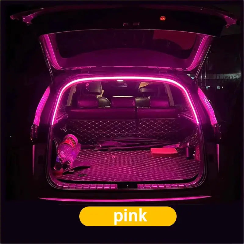 Car trunk LED light strip by Simples Market; pink wireless ambient lighting with automatic sensing tailgate