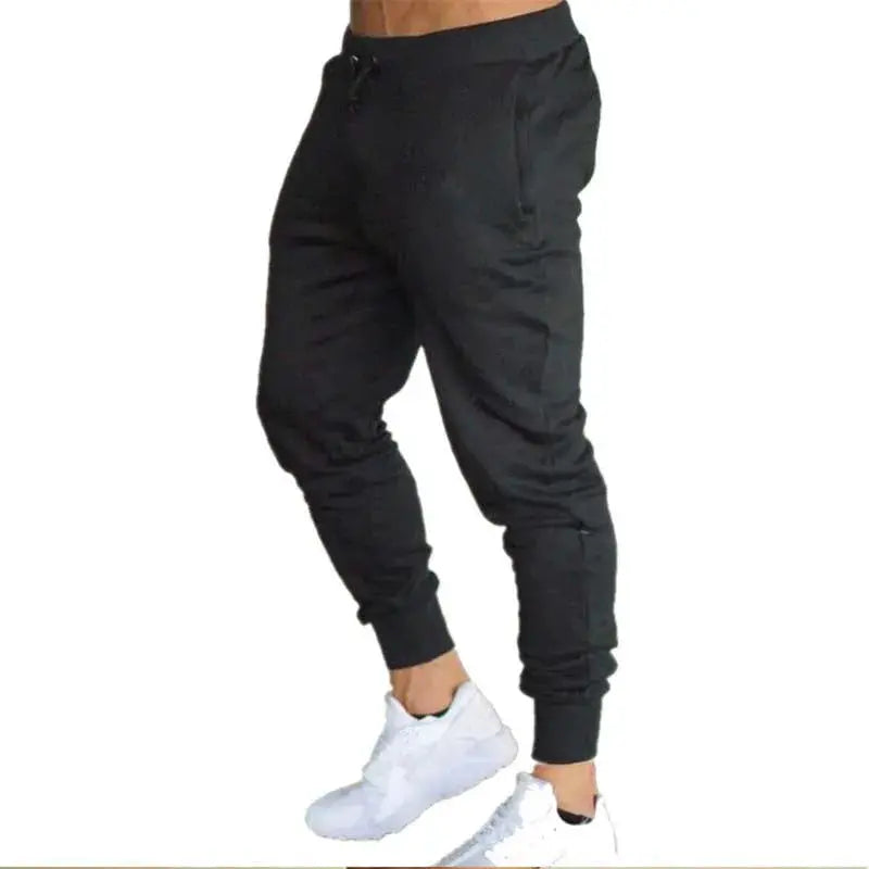 Men's black jogger pants with drawstring waist and cuffed ankles, loose straight-leg fit