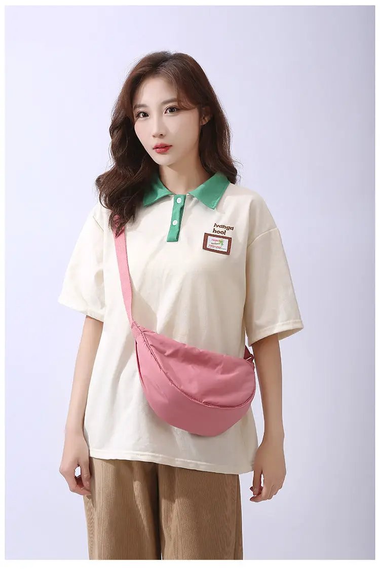 Pink padded nylon crossbody shoulder bag with adjustable strap