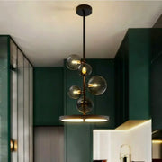Modern Art Glass Chandelier with bronze finish, clear glass globes on a vertical stem and circular ring light