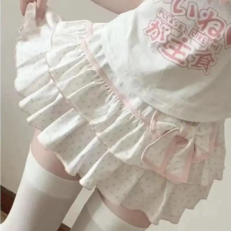 Harajuku Lolita mini skirt by Simples Market; white polka-dot layered ruffle with pink bow trim