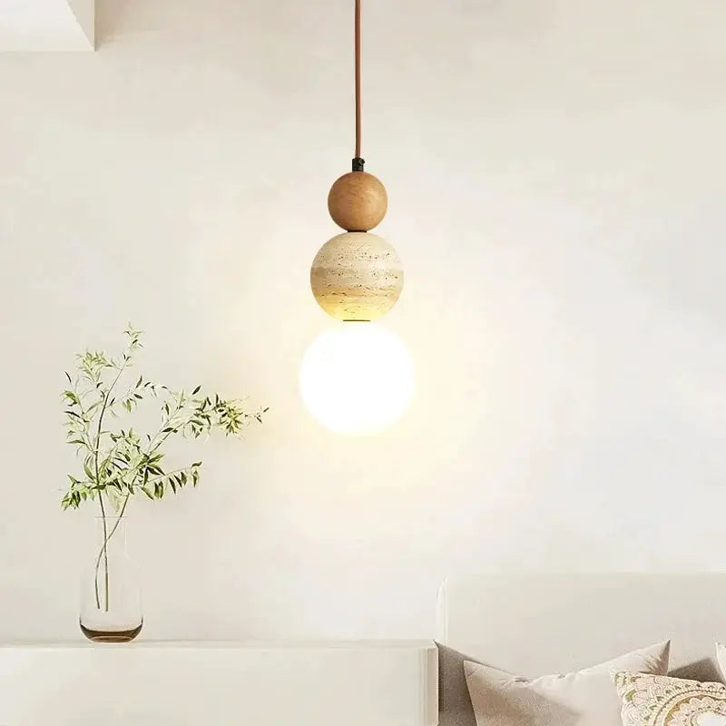Cream-style pendant lamp with stacked wood and stone beads and an LED globe bulb.