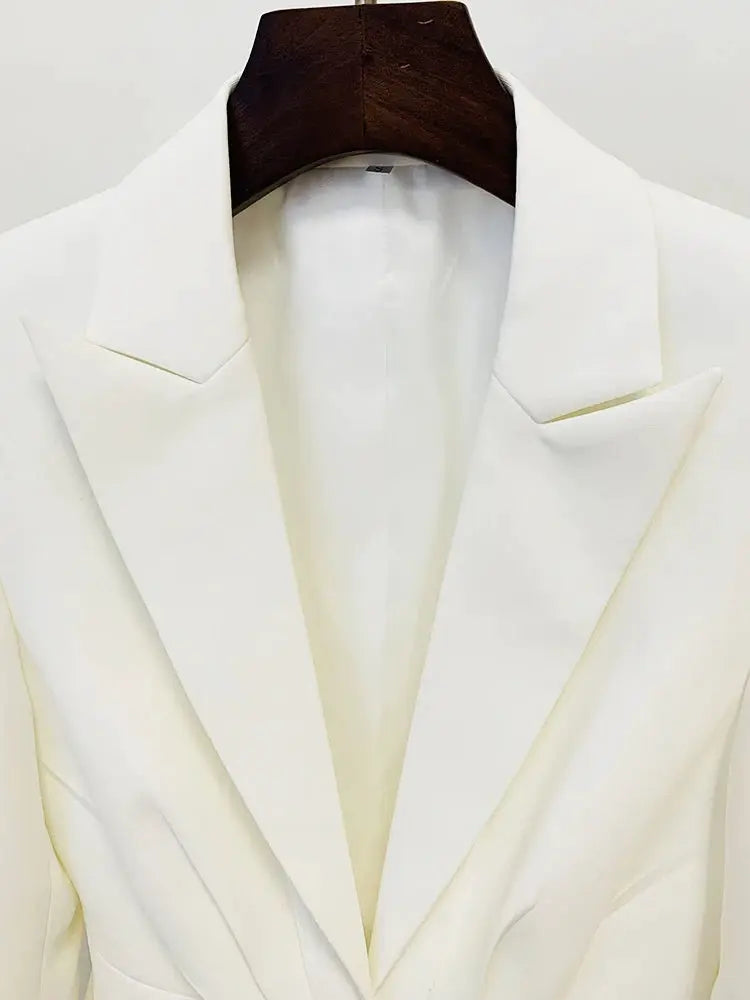 White blazer from a designer two-piece suit set on a hanger
