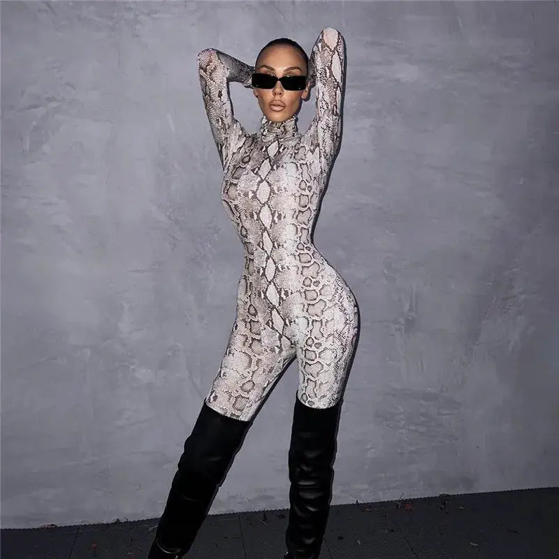 Shestyle snake-print bodycon jumpsuit with turtleneck; model wearing knee-high black boots.