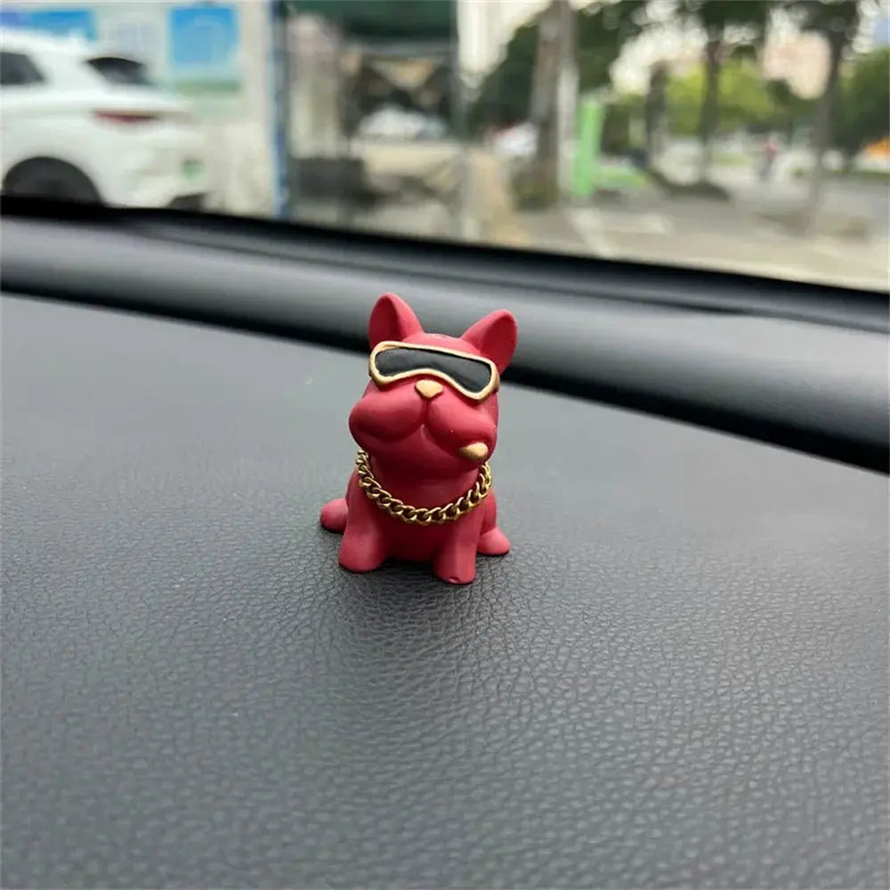 Bulldog resin car ornament in red with sunglasses and a gold chain for dashboard decor.