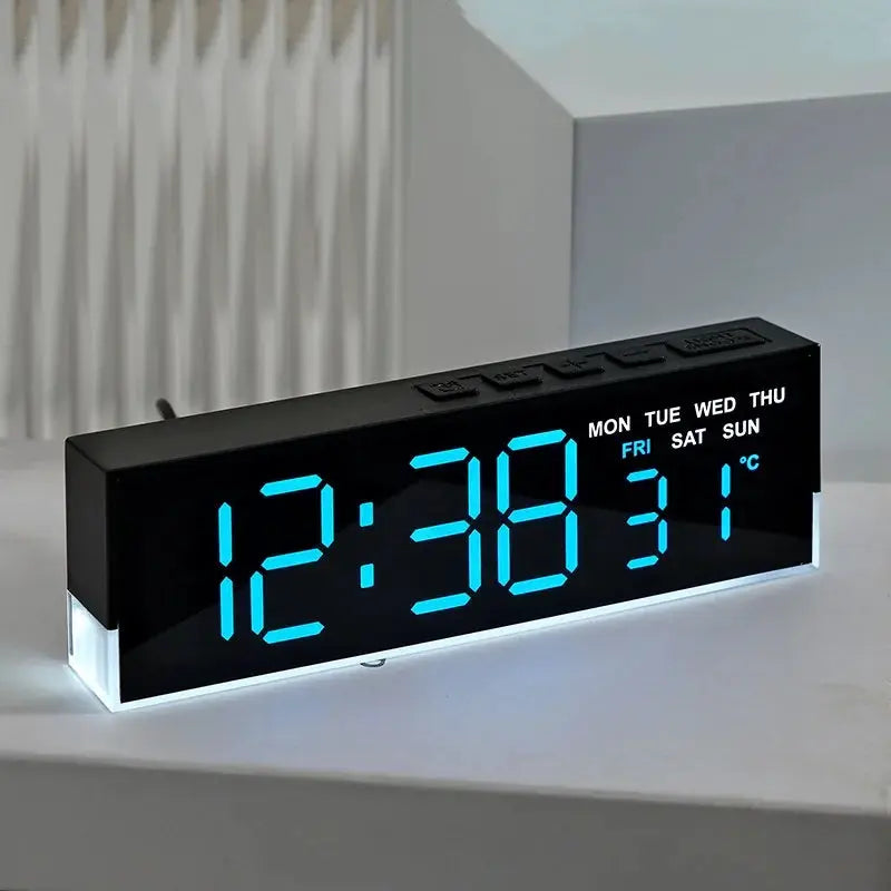 USB powered digital alarm clock with blue LED display and white mood light; weekday indicators and temperature.