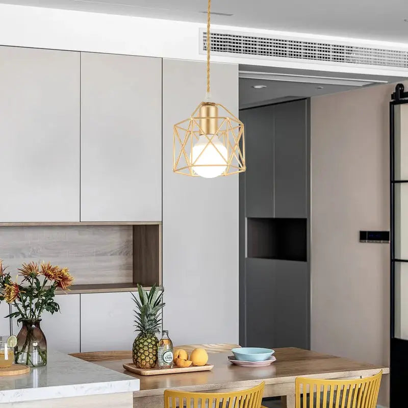Modern LED pendant light with gold geometric metal cage and exposed bulb