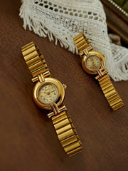 Two gold-tone French retro small-dial women's watches with Roman numerals and linked bracelets