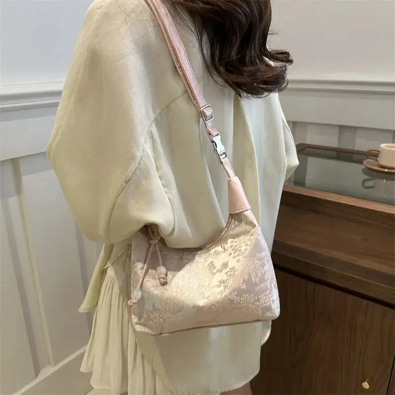 Ladies pink satin embroidered Chinese style crossbody handbag with floral pattern