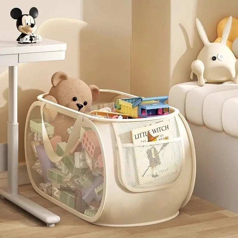 Portable large-capacity toy organizer storage bin by Simples Market, cream mesh with plush toys inside.