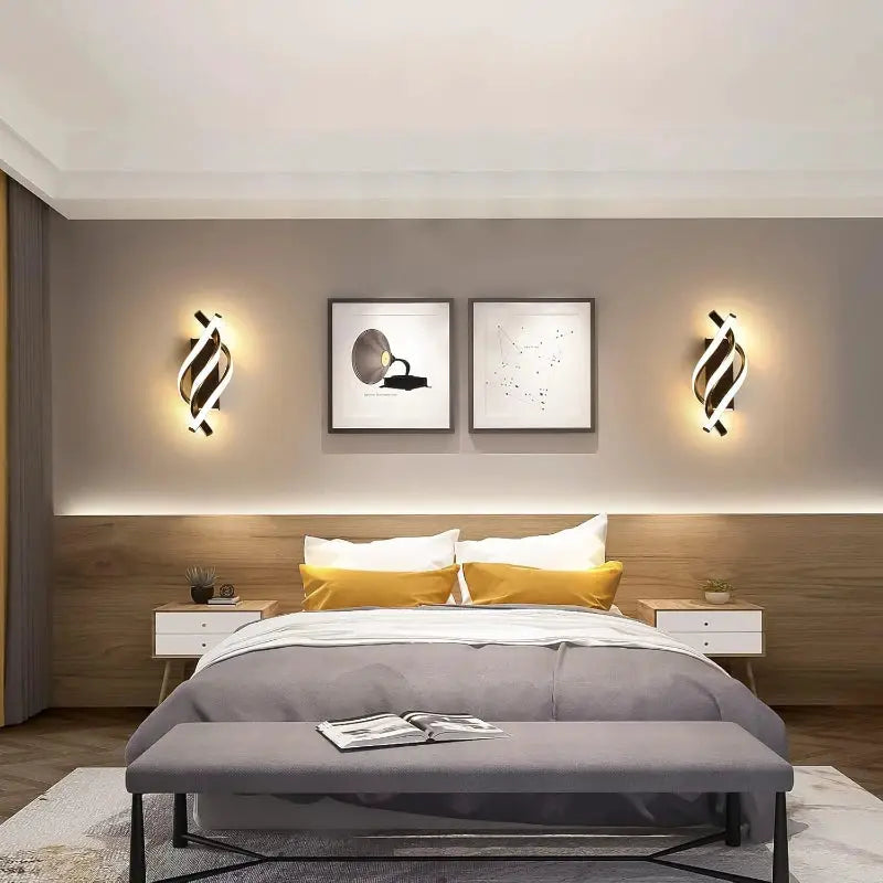 Pair of curved spiral LED wall lamps in black with warm halo, flanking a modern bedroom bed.
