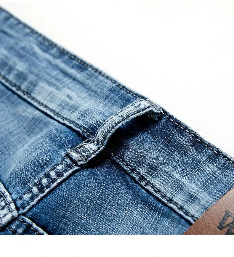 Men's denim shorts by Simples Market, classic slim fit blue jean fabric, close-up waistband stitching