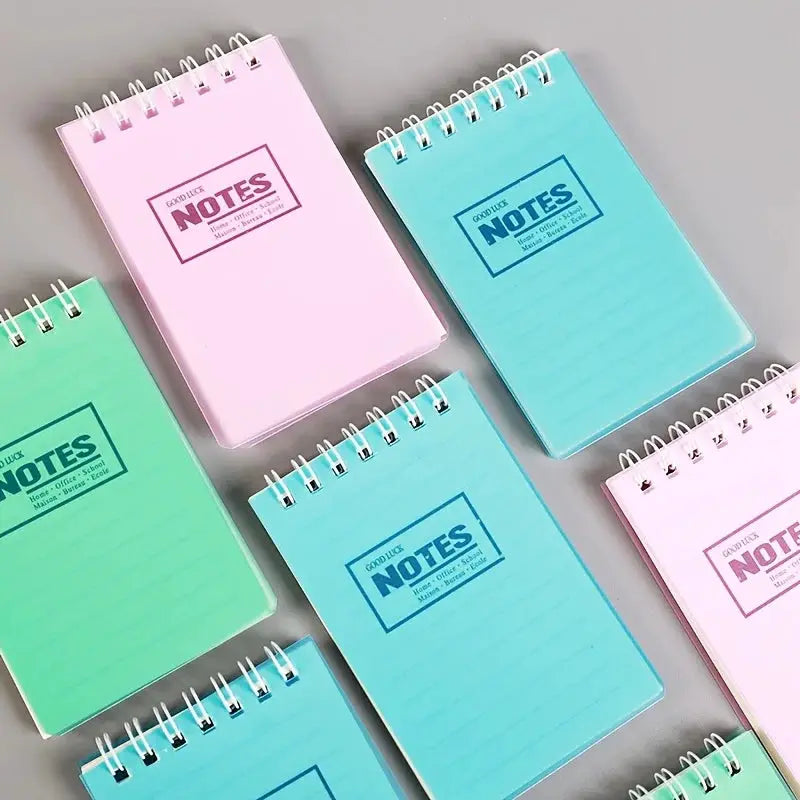 Mini pocket note pads set, 10pcs in pastel pink, blue, and green with spiral binding.
