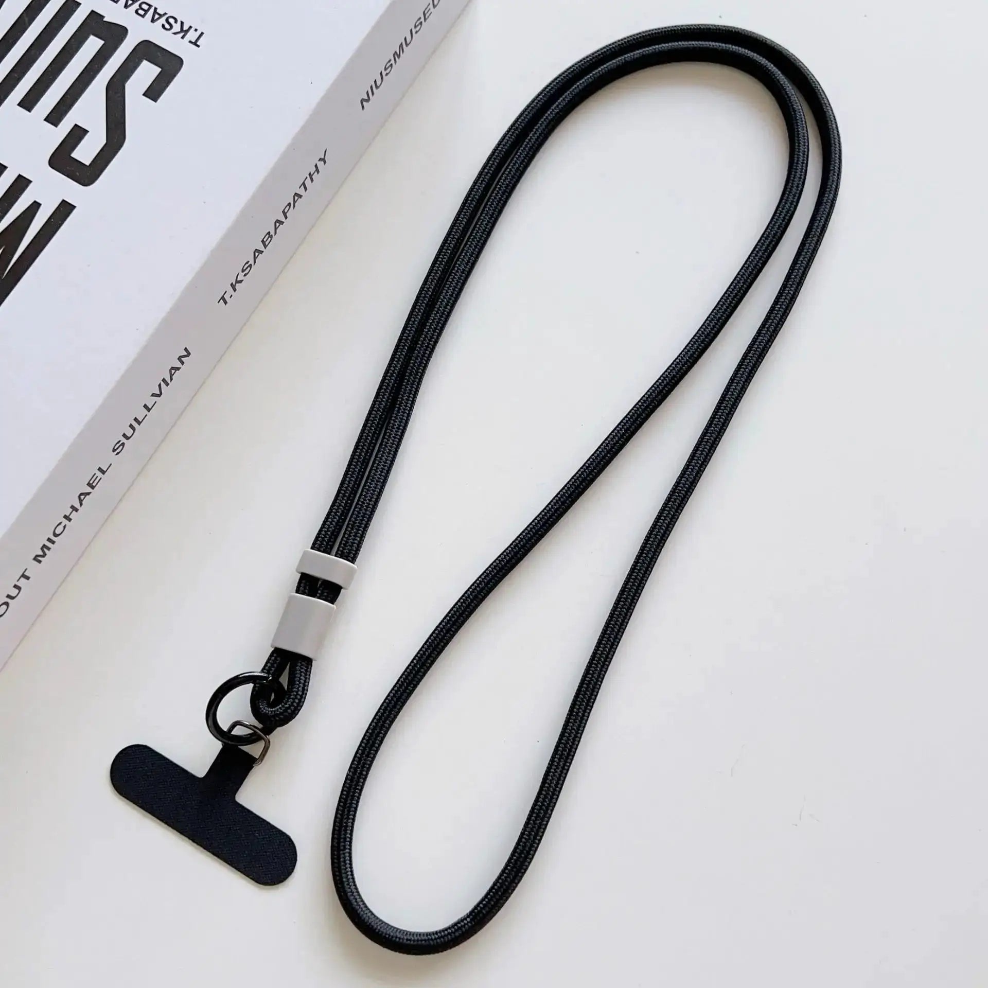 Simples Market black double-rope phone lanyard with metal ring clasps for crossbody use