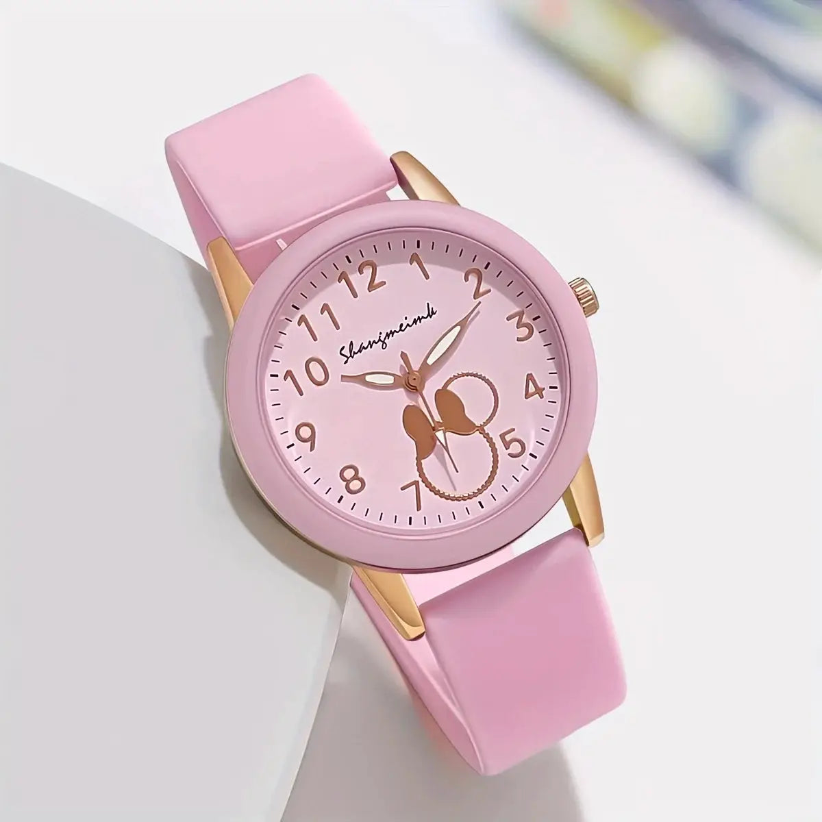 Simples Market pink round women's quartz watch with candy-pink silicone band and gold-tone case.