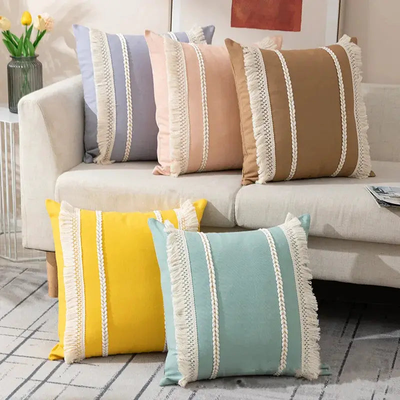 Bohemian tassel throw pillow cover set in pastel macaron colors with fringe trim on sofa